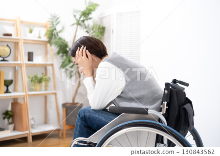 Women suffering wheelchair Women suffering wheelchair 130843562