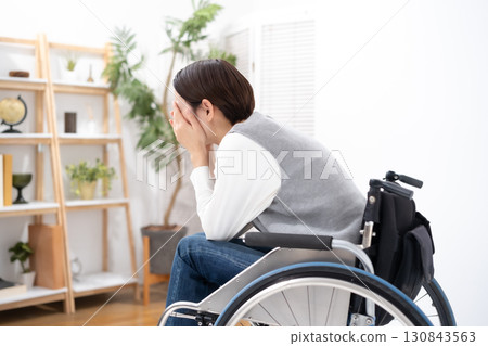 Women suffering wheelchair Women suffering wheelchair 130843563
