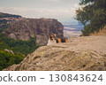 A cat sitting on the rocks of Meteora, a World Heritage Site in Greece 130843624