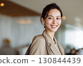 A positive woman changing jobs to advance her career, with a refreshing smile 130844439