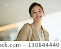 A positive woman changing jobs to advance her career, with a refreshing smile 130844440