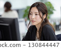 A career woman doing desk work in the office 130844447