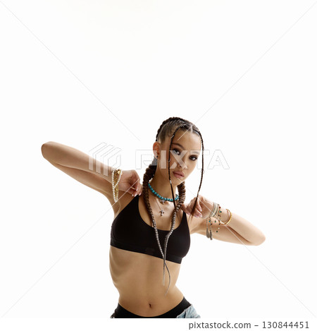 dancing beautiful girl with braids and accessories 130844451