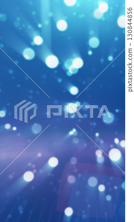 A burst of light in shades of blue, creating a dreamy and otherworldly scene with sparkling particles floating in a soft, radiant atmosphere A burst of light in shades of blue, creating a dreamy and otherworldly scene with sparkling particles floating in a soft, radiant atmosphere 130844856