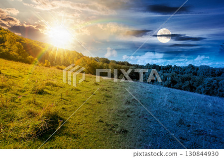 forest on the hill in rural area of carpathian mountains on autumn equinox. day and night time change concept. wonderful scenery of countryside district with sun and moon at twilight in september forest on the hill in rural area of carpathian mountains on autumn equinox. day and night time change concept. wonderful scenery of countryside district with sun and moon at twilight in september 130844930