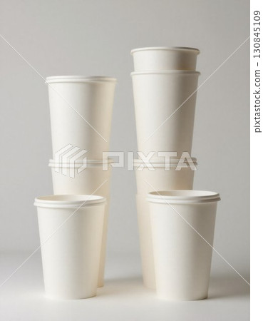 white disposable cups on a white background white disposable cups on a white background 130845109