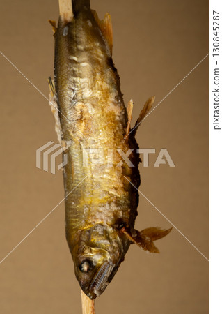 Image of charcoal-grilled salted sweetfish bought at a food stall Image of charcoal-grilled salted sweetfish bought at a food stall 130845287