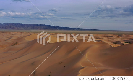 Aerial view of sand dunes in desert at sunset Aerial view of sand dunes in desert at sunset 130845803