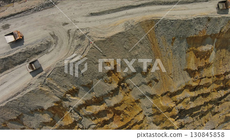 Aerial of open mine and heavy mining equipment Aerial of open mine and heavy mining equipment 130845858