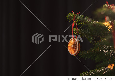Closeup small christmas tree with natural decorations indoor 130846008