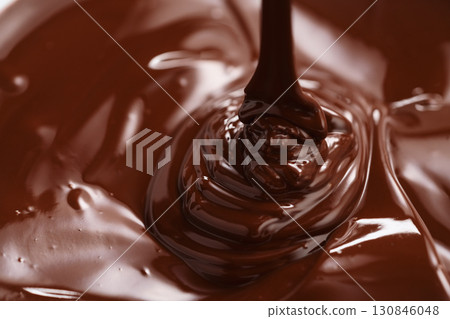 poured melted dark chcolate background closeup poured melted dark chcolate background closeup 130846048