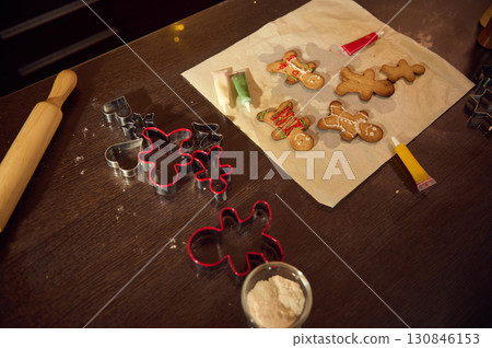 Festive Gingerbread Baking Session With Cookie Cutters and Decorations Setup Festive Gingerbread Baking Session With Cookie Cutters and Decorations Setup 130846153