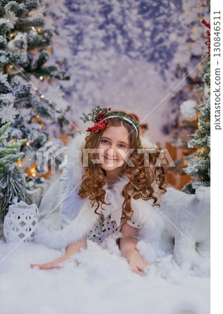 A girl lying in a festive winter setting 130846511