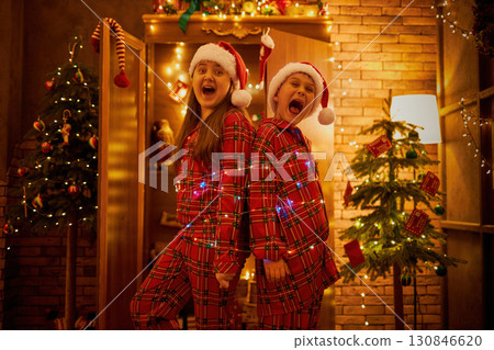 Playful Christmas mischief with tangled lights 130846620