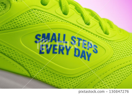 Neon Lime Sneaker Detail With Motivational Slogan And Mesh Texture Neon Lime Sneaker Detail With Motivational Slogan And Mesh Texture 130847276