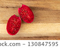 Halved prickly pear fruit on wood boar. Ripe cactus fruit Opuntia 130847595