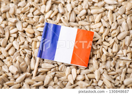 Flag of France on sunflower seeds. Origin of grain, growing sunflowers in France concept 130848687