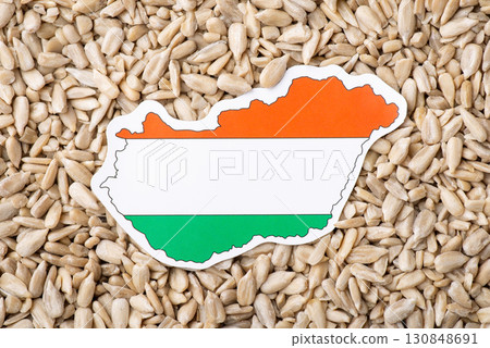 Flag and map of Hungary on sunflower seeds. Origin of grain, growing sunflowers in Hungary concept Flag and map of Hungary on sunflower seeds. Origin of grain, growing sunflowers in Hungary concept 130848691