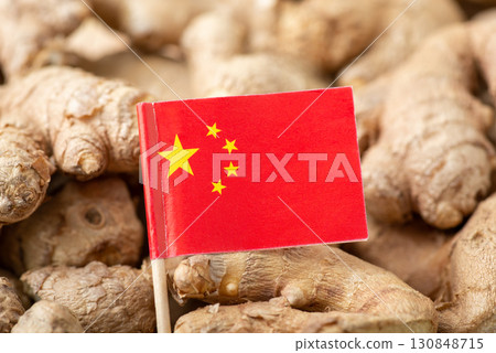 Flag of China on ginger. Origin of spices, trade of ginger around the world concept 130848715