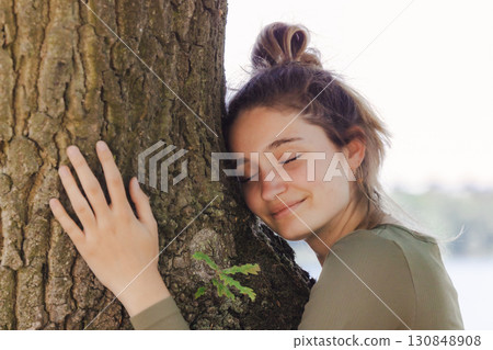 Embracing the serenity of nature, finding a serene and peaceful moment with a majestic tree 130848908