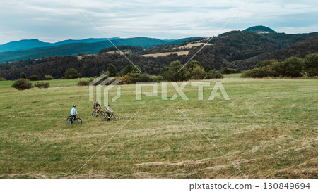 Young family on biking trip in nature. Young family on biking trip in nature. 130849694