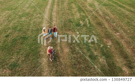 Aerial view of multigenerational family on hiking trip in nature. 130849727