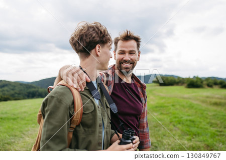 Father spending weekend with son on hike in nature. Father spending weekend with son on hike in nature. 130849767