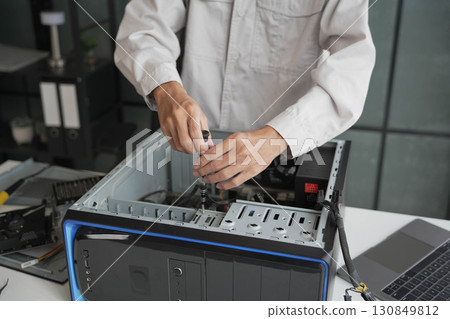 Computer Hardware dissemblers fixing computer PC. 130849812