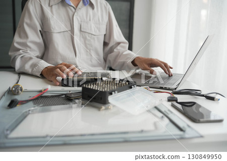 Computer Hardware dissemblers fixing computer PC. 130849950