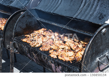 Smoky Barbecue Chicken on Outdoor Charcoal Grill Smoky Barbecue Chicken on Outdoor Charcoal Grill 130850134