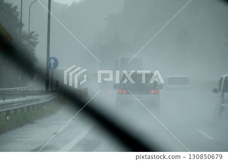 A sudden downpour while driving on the highway A sudden downpour while driving on the highway 130850679