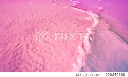 The Pink lake of Torrevieja. Salty texture of Pink lake. Water nature background 130850868