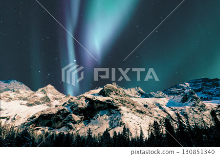 night view of snowy mountain range and milky way. starry night sky with stars and moon. beautiful landscape with snowy mountain peaks in winter night. 130851340