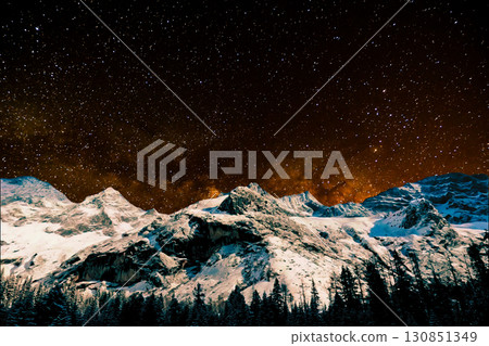 night view of snowy mountain range and milky way. starry night sky with stars and moon. beautiful landscape with snowy mountain peaks in winter night. 130851349