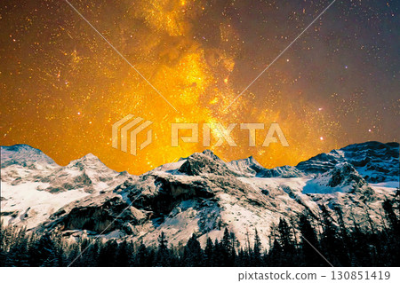 night view of snowy mountain range and milky way. starry night sky with stars and moon. beautiful landscape with snowy mountain peaks in winter night. 130851419