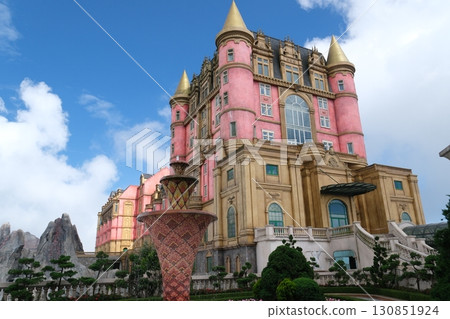 A beautiful medieval stone town in a French village in Ba Na Hills Park at sunset. Da Nang, Vietnam A beautiful medieval stone town in a French village in Ba Na Hills Park at sunset. Da Nang, Vietnam 130851924