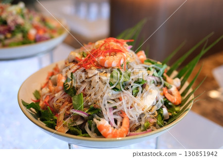 Shrimp salad with fresh mango noodles and vegetables Shrimp salad with fresh mango noodles and vegetables 130851942