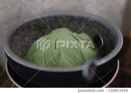 fragrant wasabi powder on a black wooden background. 130851948