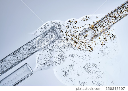 Three test tubes with spilled serums. Demonstration of textures. 130852307