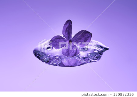 A textured drop of serum with lilac. A textured drop of serum with lilac. 130852336