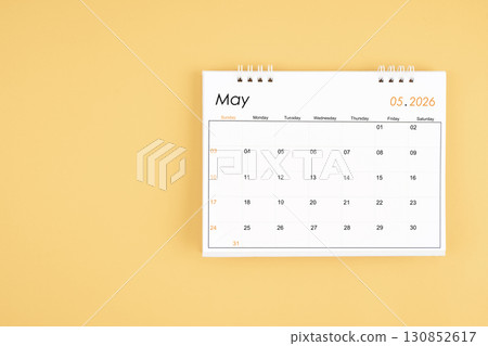 May 2026 desk calendar on yellow color background, position with copy space. 130852617