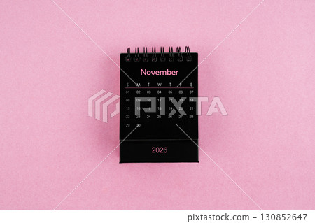 Black calendar for November 2026 year on pink color background. 130852647