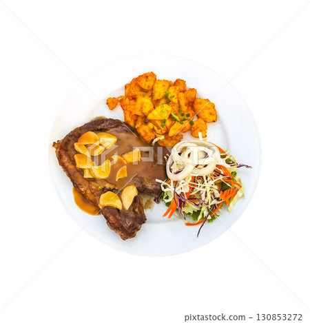 Isolated succulent steak with garlic gravy, spiced potatoes, and fresh salad on a white plate on transparent background creates a balanced and inviting meal. Healthy, comfort food 130853272