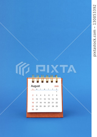 August 2026 white desk calendar on blue color background. August 2026 white desk calendar on blue color background. 130853392