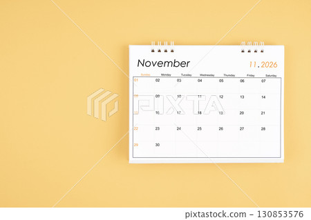 November desk calendar on yellow color background, position with copy space. November desk calendar on yellow color background, position with copy space. 130853576