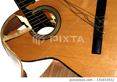 A broken smashed acousitic guitar music instrument on white background A broken smashed acousitic guitar music instrument on white background 130853652