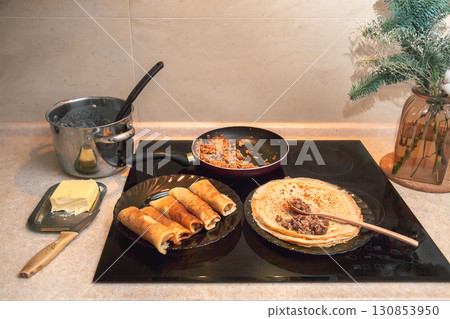 Cooking homemade Russian pancakes Bliny with meat on Shrovetide - Maslenitsa. Cooking at home 130853950