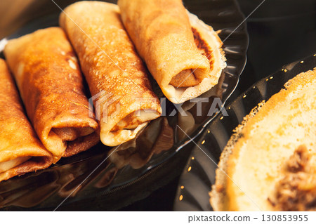 Cooking homemade Russian pancakes Bliny with meat on Shrovetide - Maslenitsa 130853955