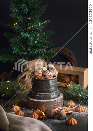 Picci - Christmas shortbread cookies in vintage jar on background of fir branches Picci - Christmas shortbread cookies in vintage jar on background of fir branches 130853969