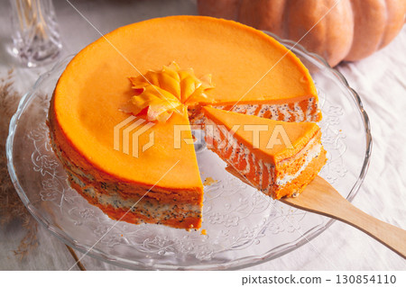 Homemade cottage cheese and pumpkin striped casserole with poppy seeds and orange and cut piece and pumpkins Homemade cottage cheese and pumpkin striped casserole with poppy seeds and orange and cut piece and pumpkins 130854110